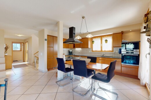 kitchen featuring stainless steel appliances, range hood, tasteful backsplash, and wood finish cabinetry