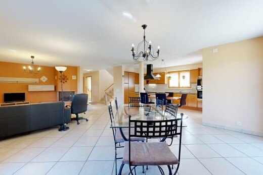 dining room with a chandelier and light tile patterned floors