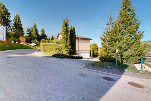 outdoor house featuring a garage and driveway