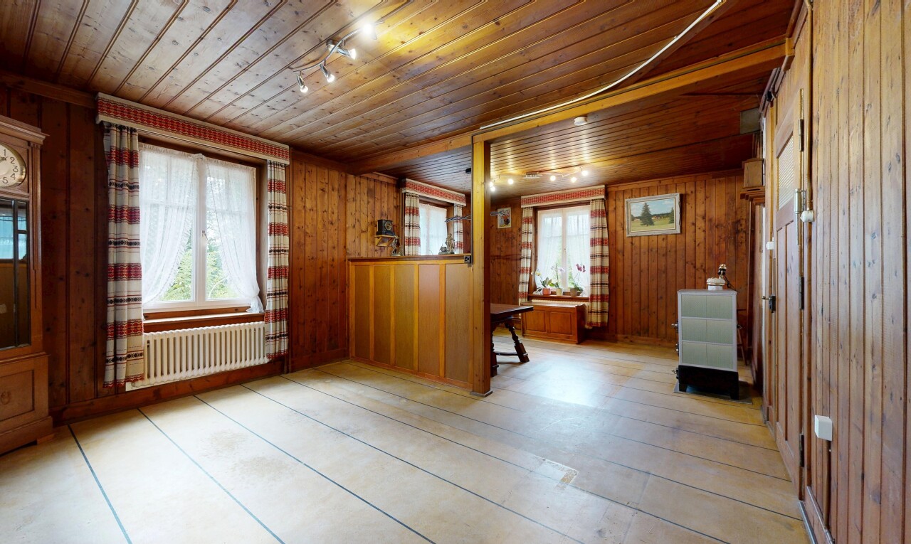 pièce vide avec éclairage sur rail, radiateur, wood wall, mur en bois, et wood ceiling