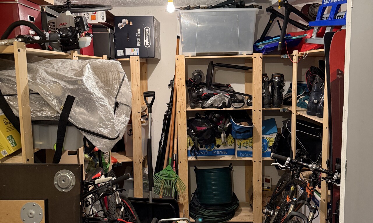 storage / pantry with decorative light fixtures