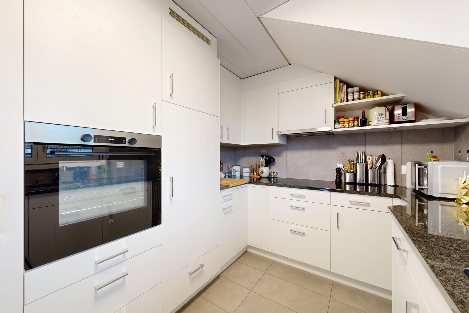kitchen featuring oven, white cabinets, light tile patterned flooring, modern cabinets, and open shelves