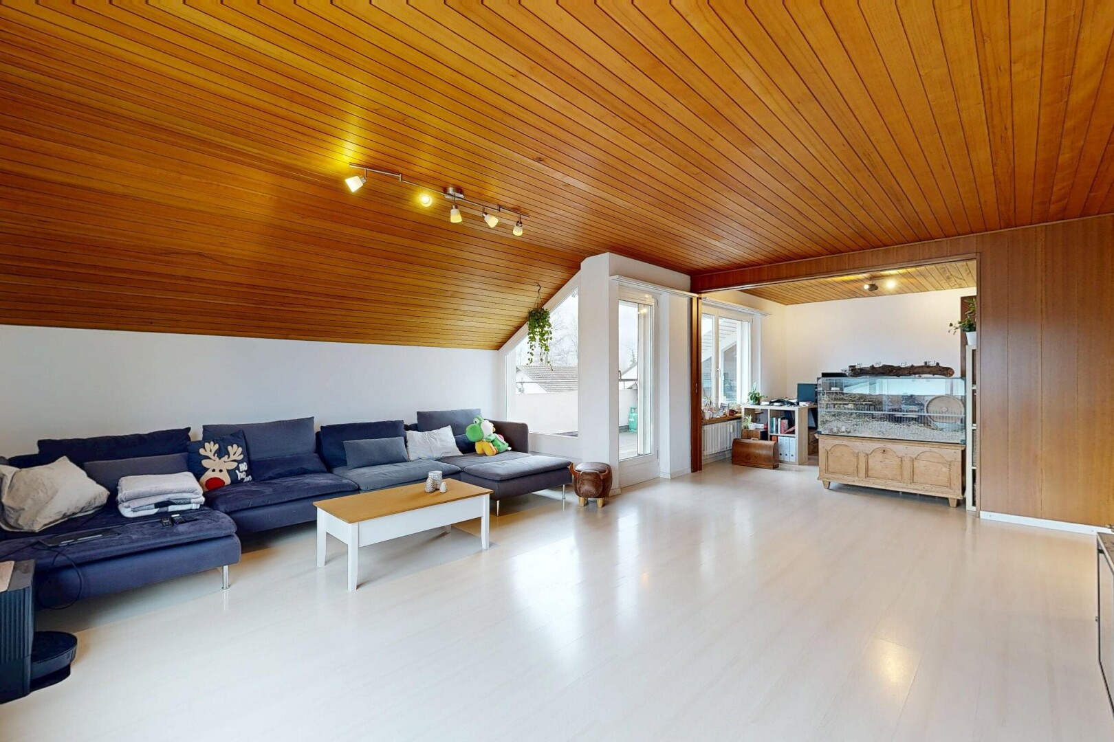 living area featuring wood ceiling, lofted ceiling, light wood finished floors, and track lighting