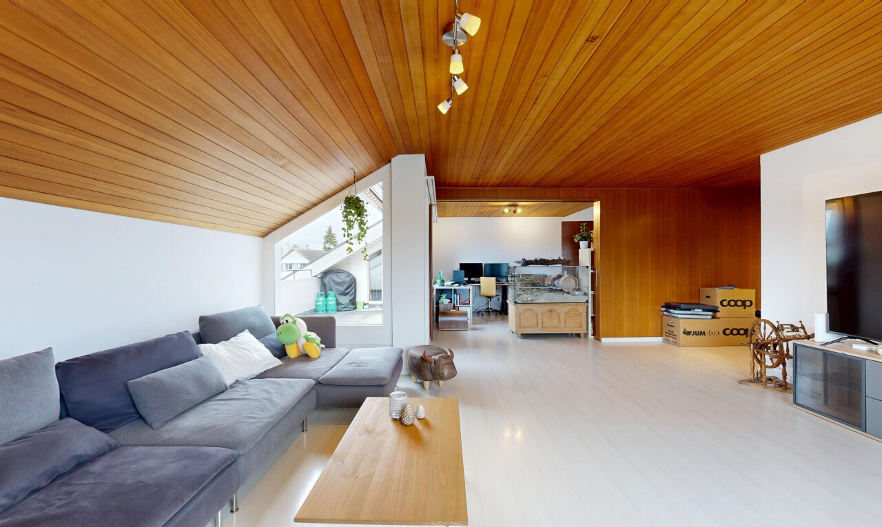 living room featuring rail lighting, wooden ceiling, and light wood finished floors