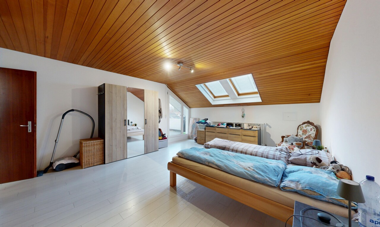 room / bedroom featuring a skylight, wooden ceiling, lofted ceiling, and wood finished floors