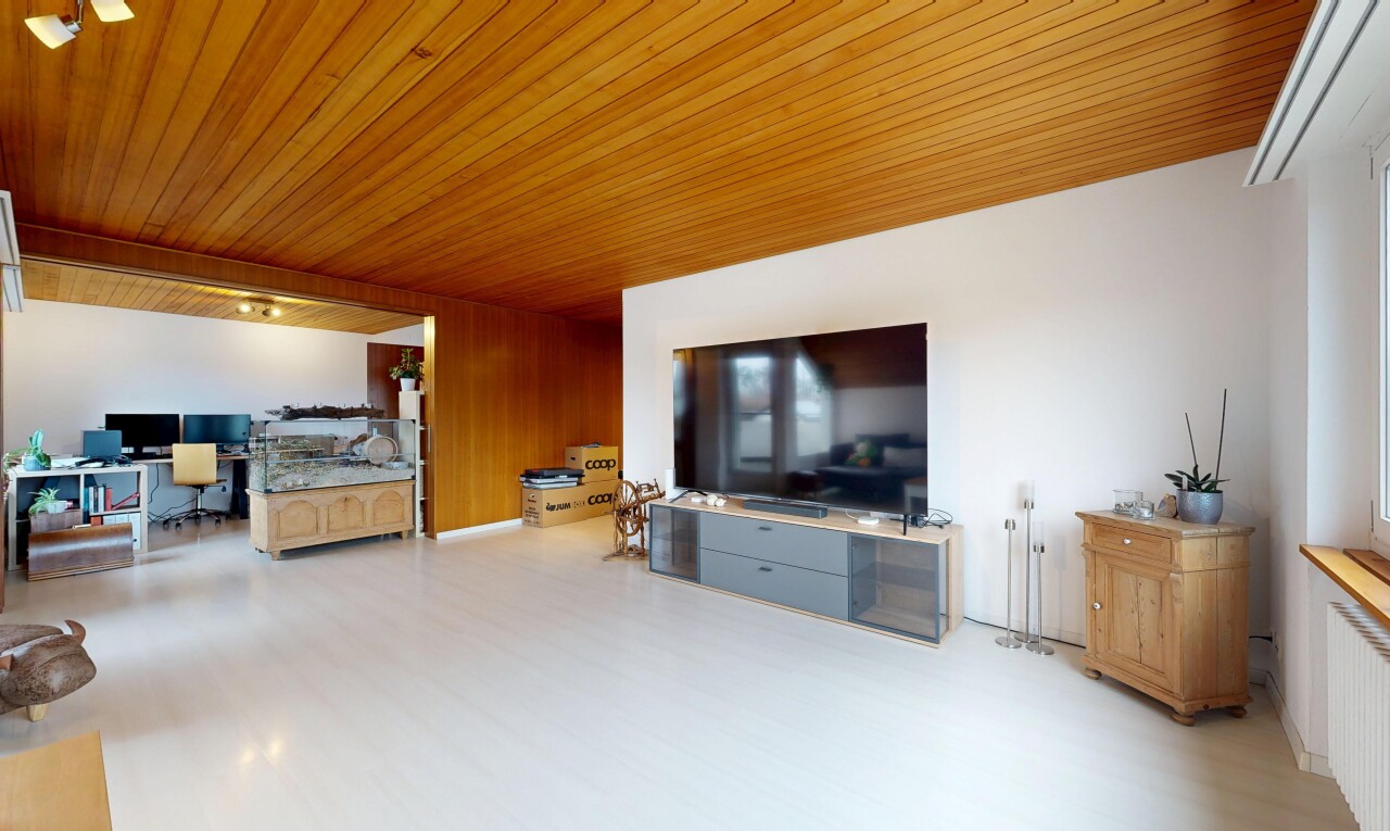 living area featuring a desk, wooden ceiling, and wood finished floors