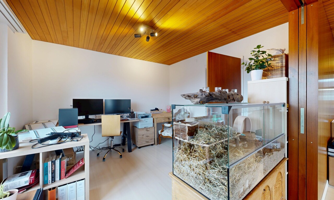 office space with light wood-style floors and wooden ceiling