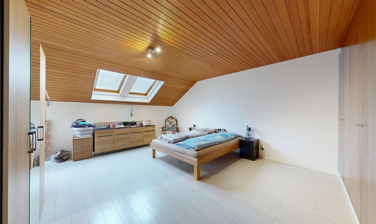 room / bedroom featuring a skylight, vaulted ceiling, wood ceiling, and light wood-type flooring