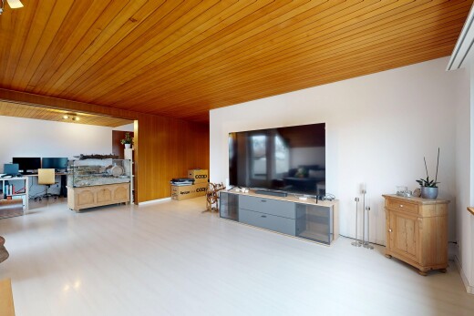 living area featuring a desk, wooden ceiling, and wood finished floors