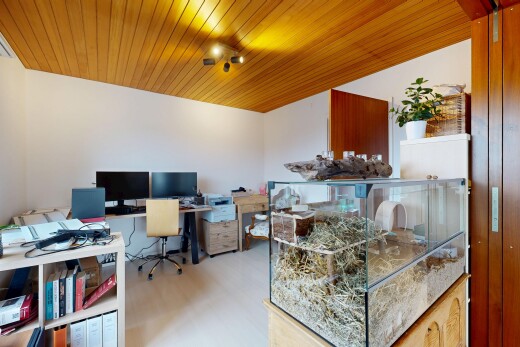 office space with light wood-style floors and wooden ceiling