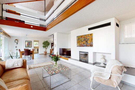 living room featuring a glass covered fireplace