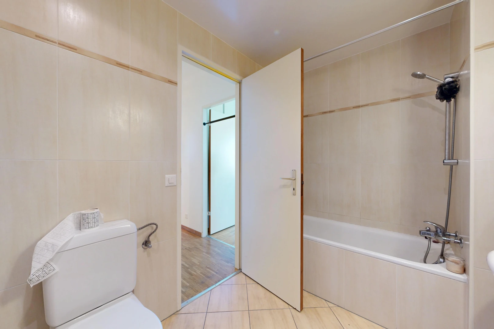 bathroom with tiled shower / bath, tile walls, and light tile patterned floors