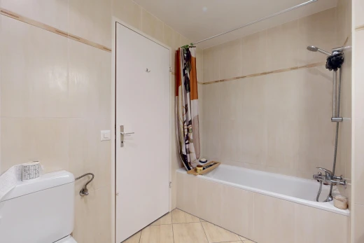 full bathroom featuring tiled shower / bath and light tile patterned flooring