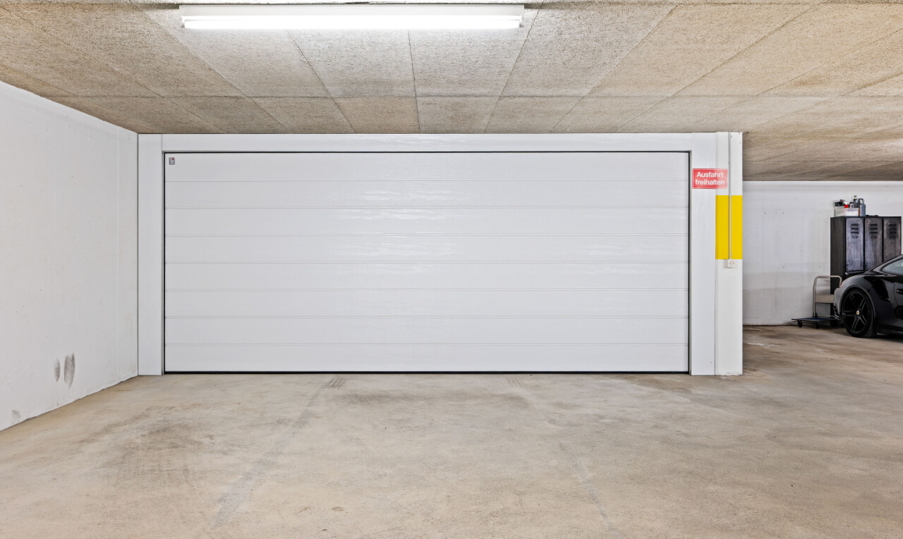 view of parking with a parking deck
