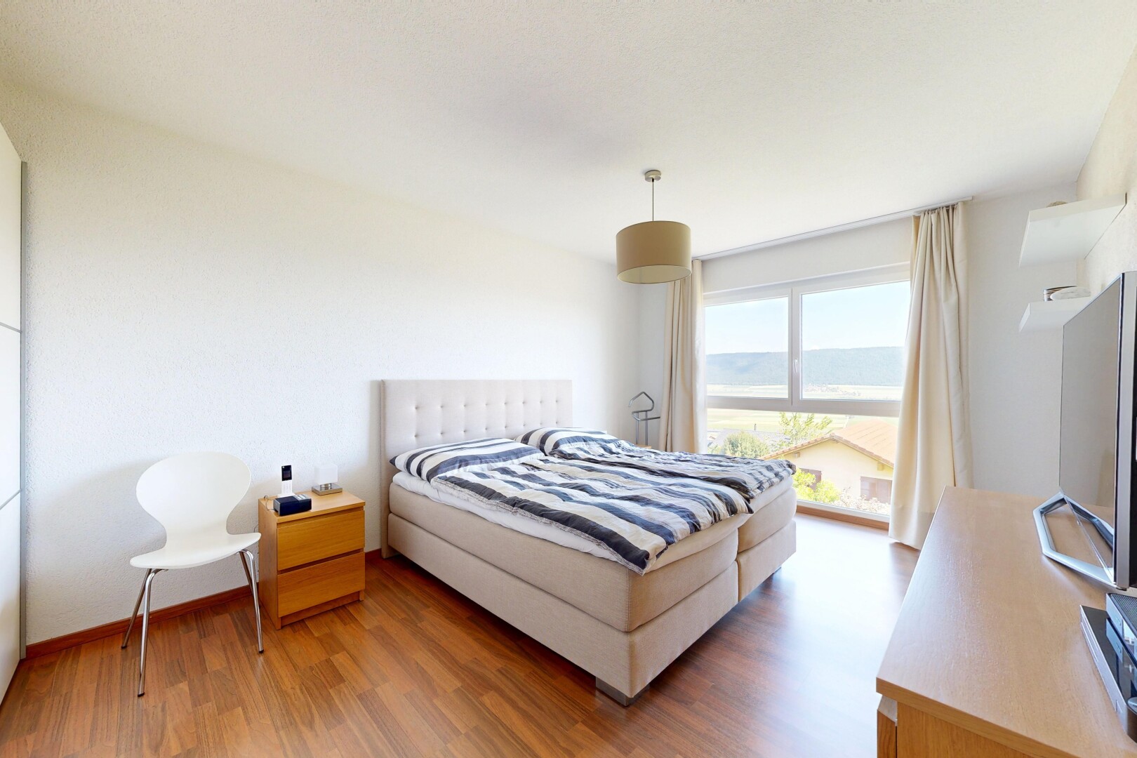 room / bedroom featuring light wood-style floors and access to outside