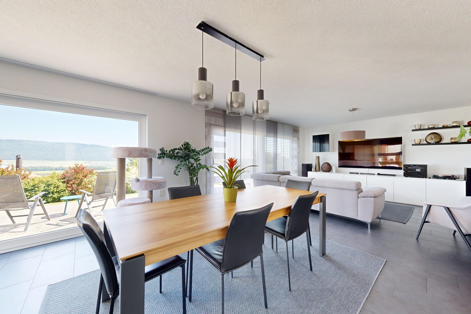 living area featuring a textured ceiling