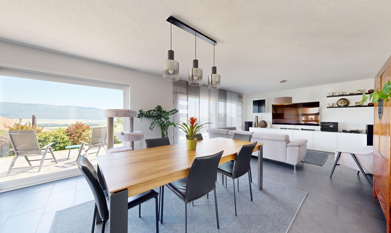 living area featuring a textured ceiling