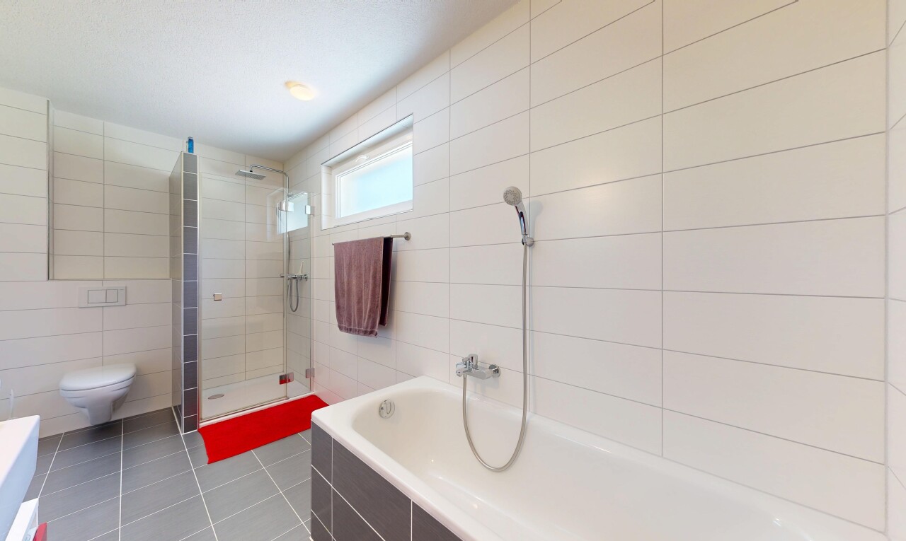 bathroom featuring tile walls, tiled shower, a bath, and light tile patterned floors
