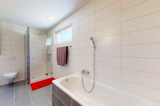 bathroom featuring tile walls, tiled shower, a bath, and light tile patterned floors