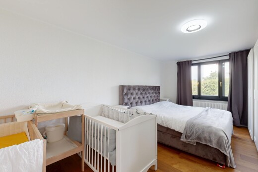 room / bedroom featuring light wood-style flooring and radiator
