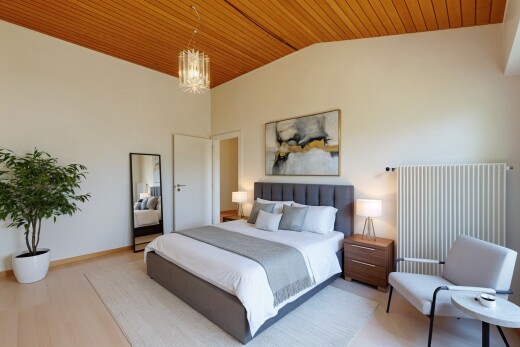 room with wood ceiling, radiator heating unit, wood finished floors, vaulted ceiling, and a chandelier