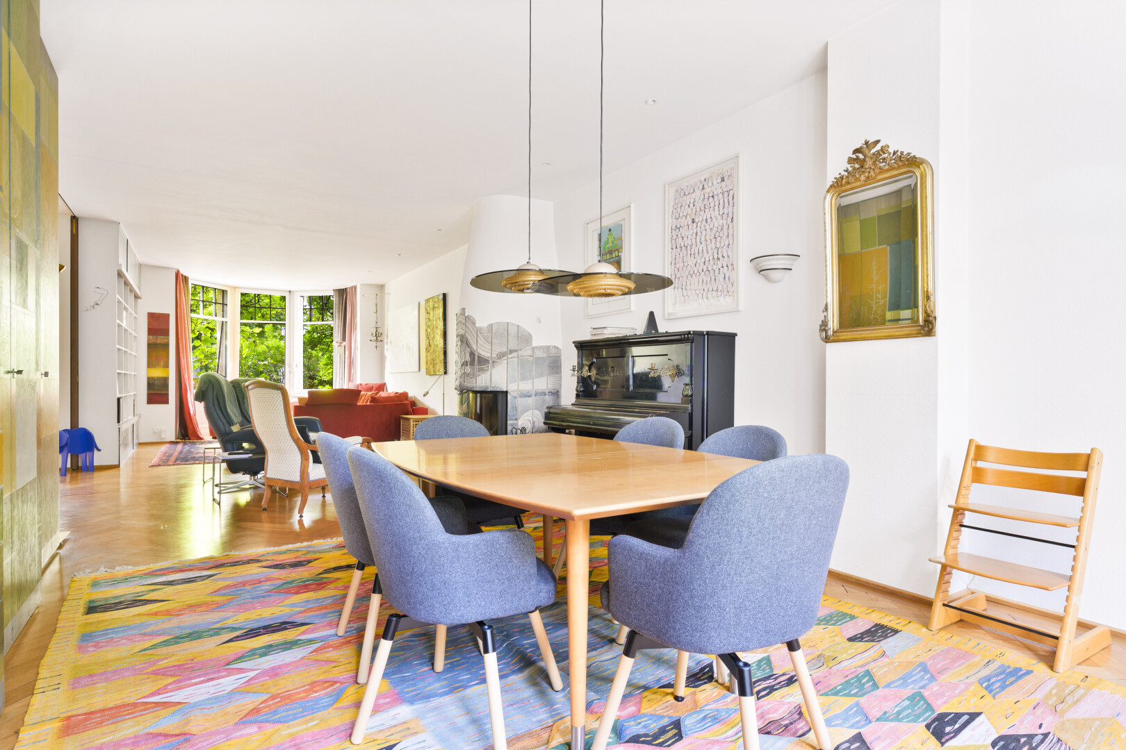 dining space with wood finished floors and floor to ceiling windows