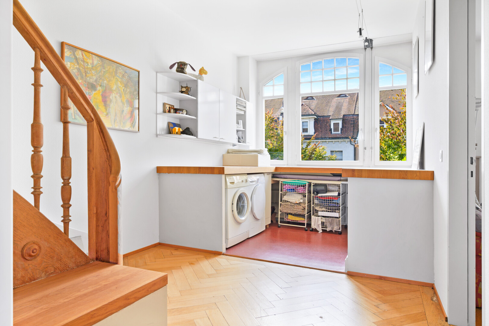 kitchen featuring healthy amount of natural light, white cabinetry, open shelves, and wooden counters
