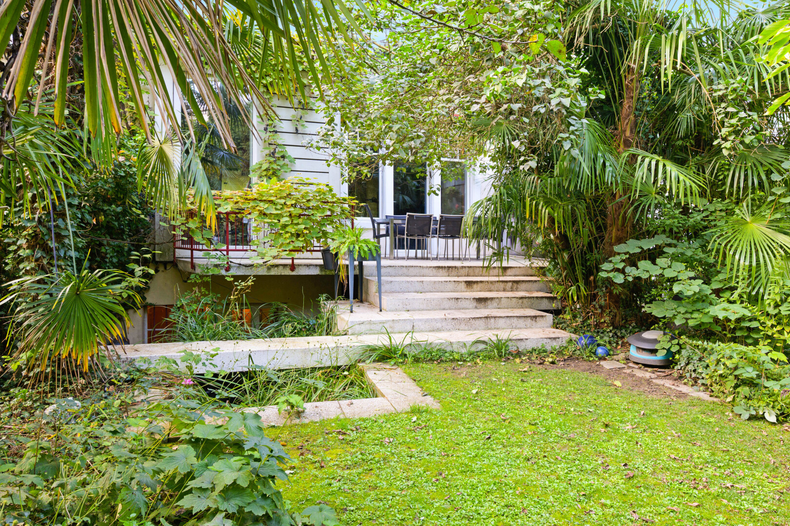 garden with a lawn and a deck