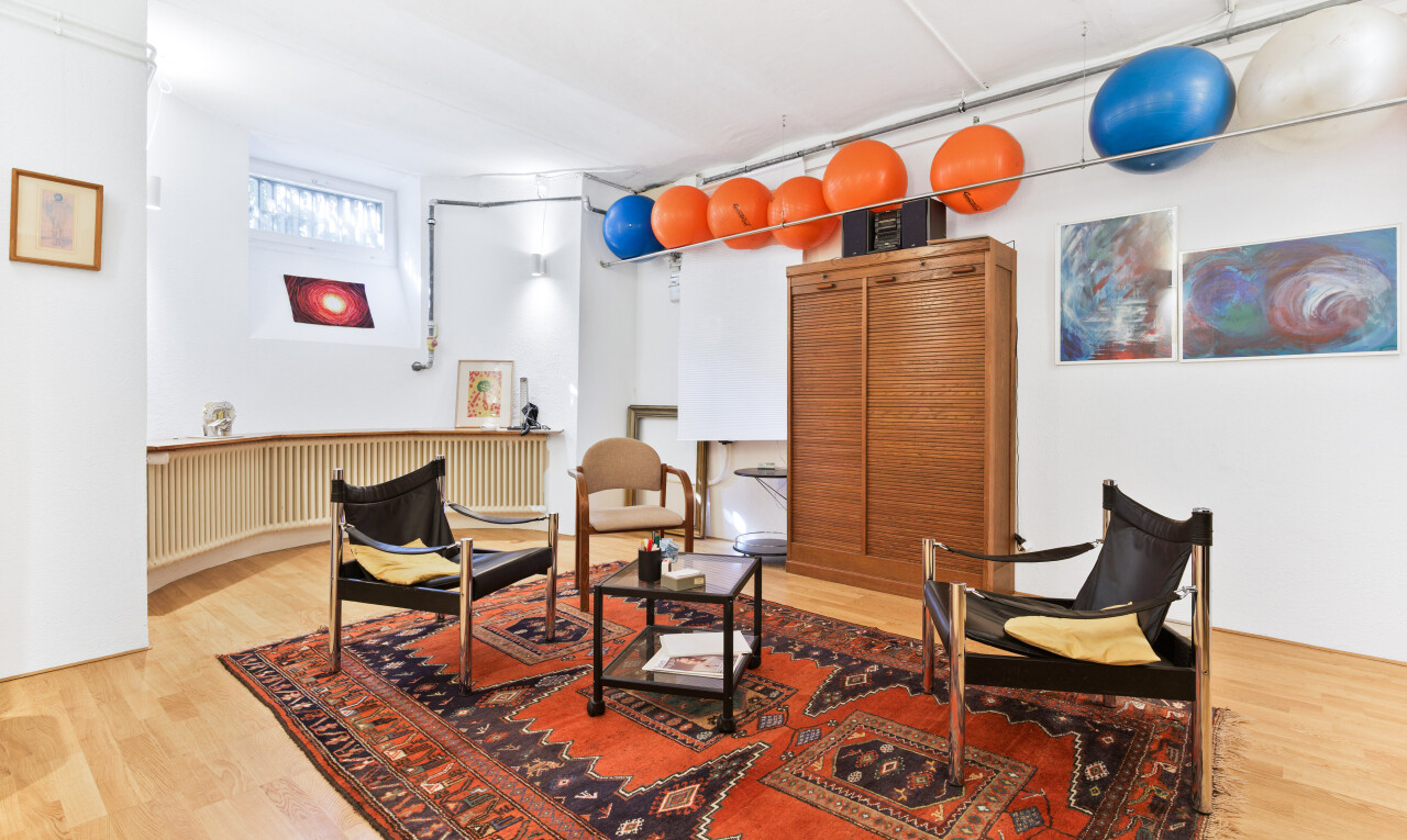 dining space with light wood finished floors and radiator heating unit