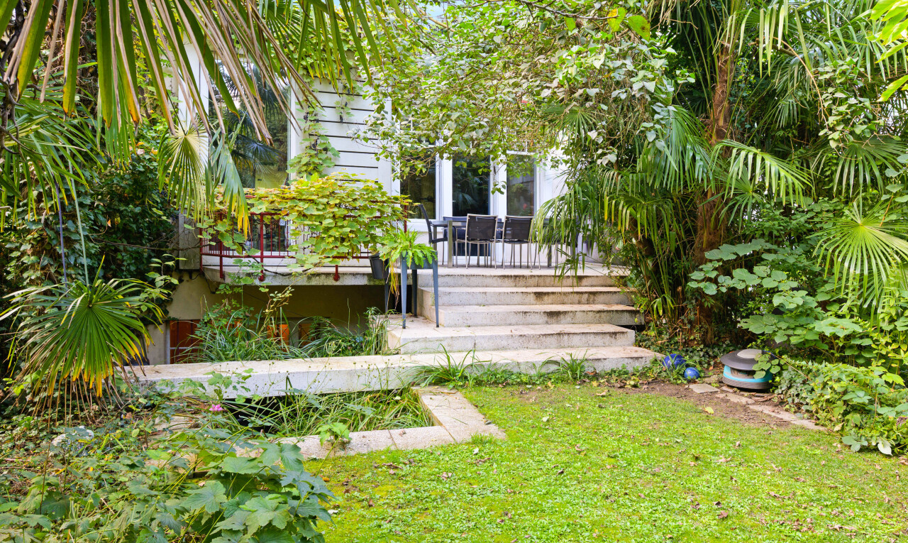 garden with a lawn and a deck