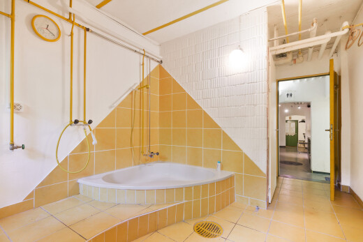 full bathroom with tiled shower / bath, tile patterned floors, and tile walls