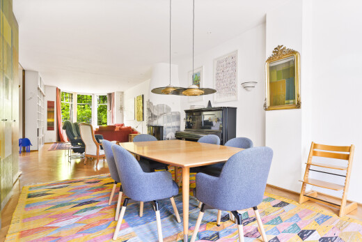 dining space with wood finished floors and floor to ceiling windows