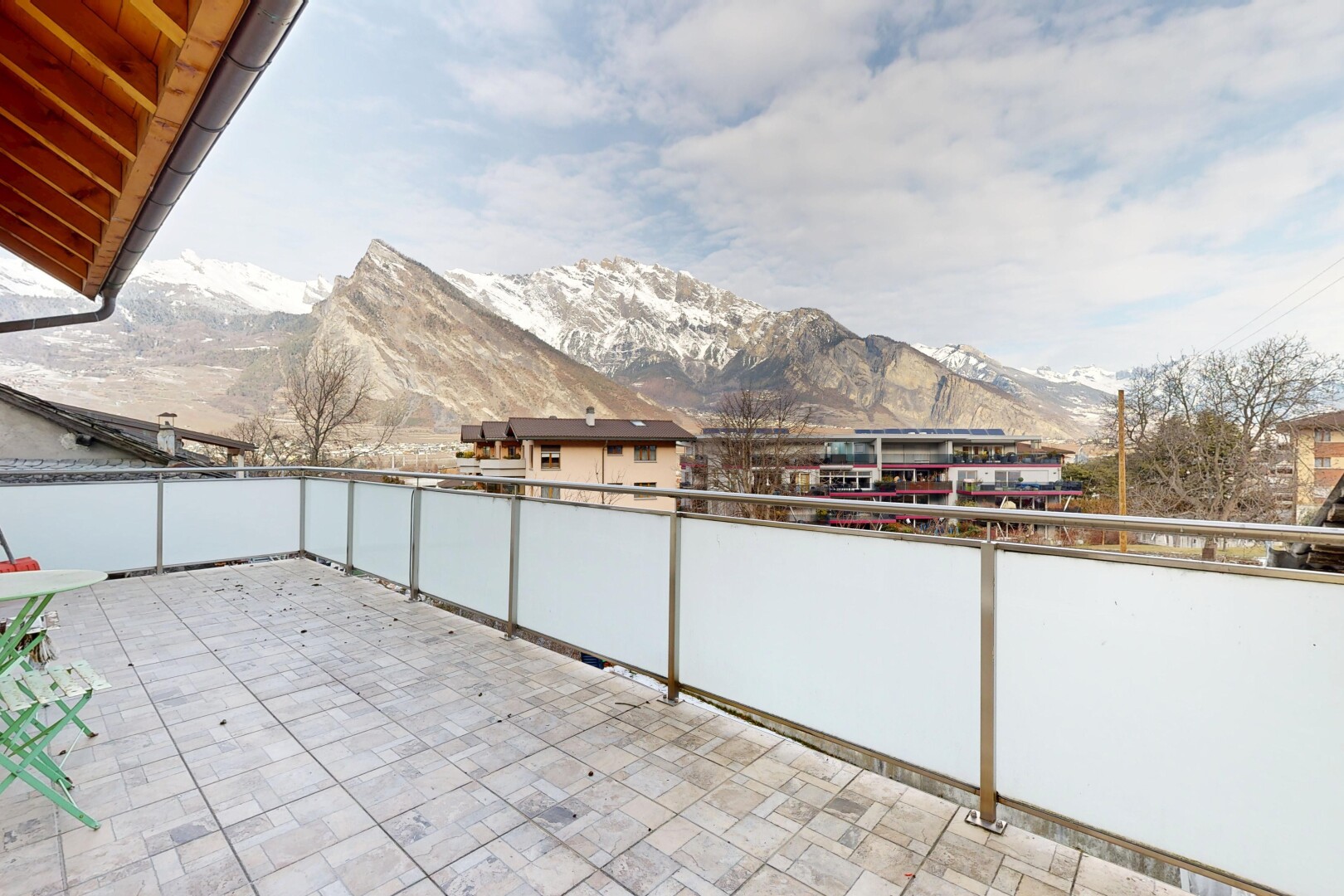 terrace featuring a patio and a mountain view
