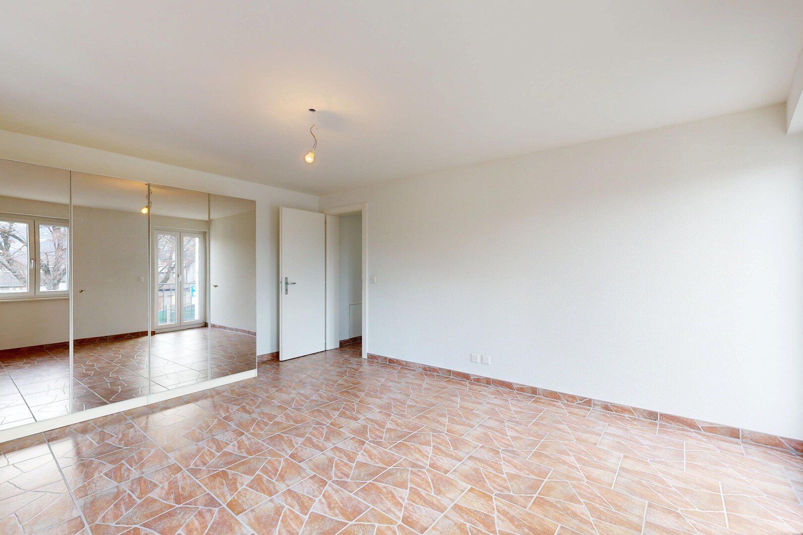 spare room with baseboards