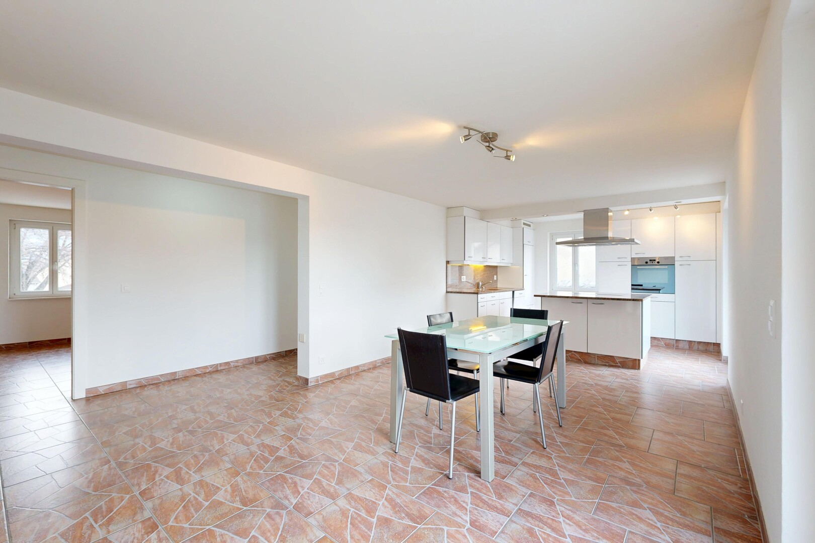 dining space with stone finish flooring
