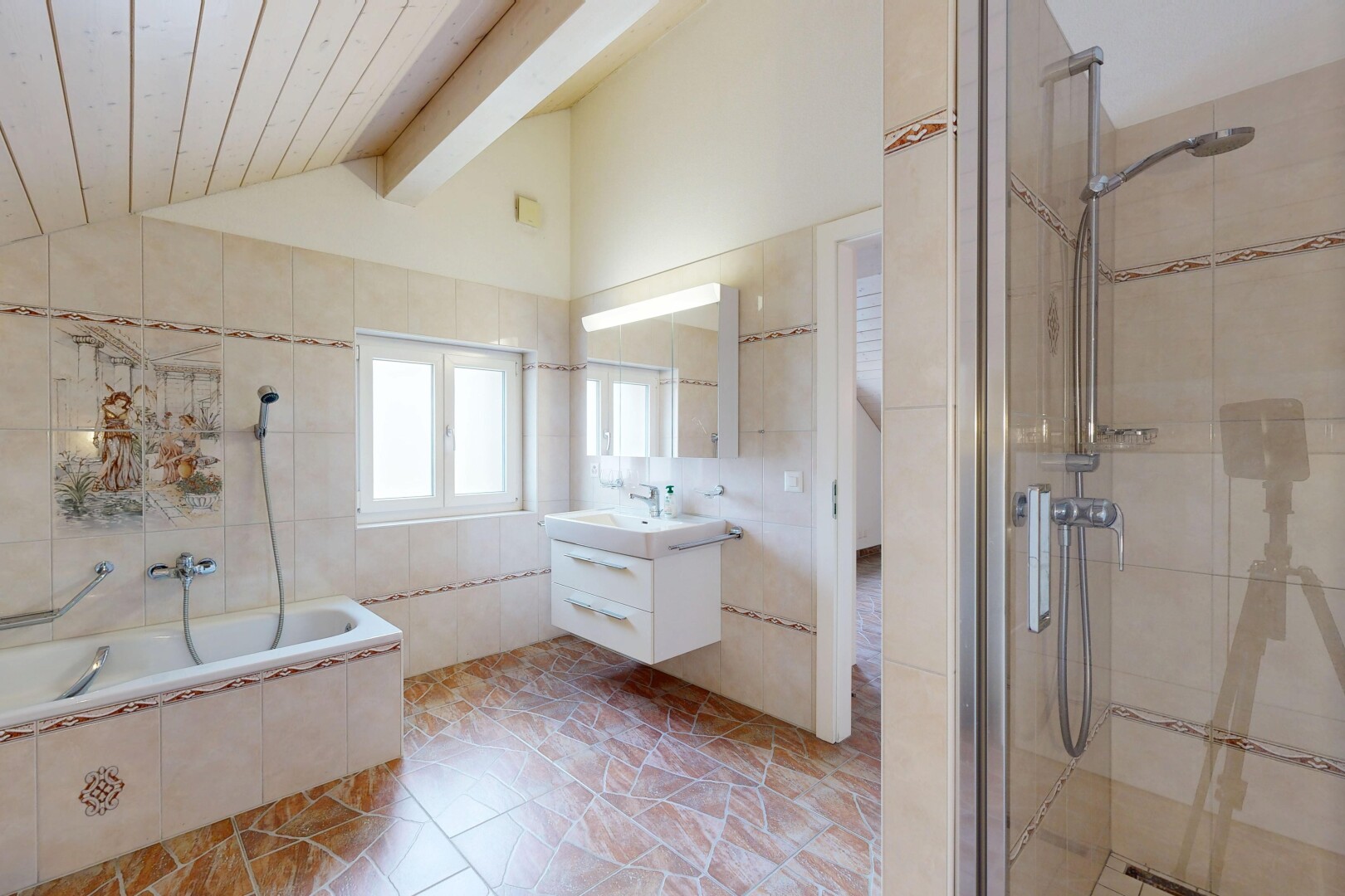 bathroom featuring tile walls, a tile shower, vanity, and tiled tub