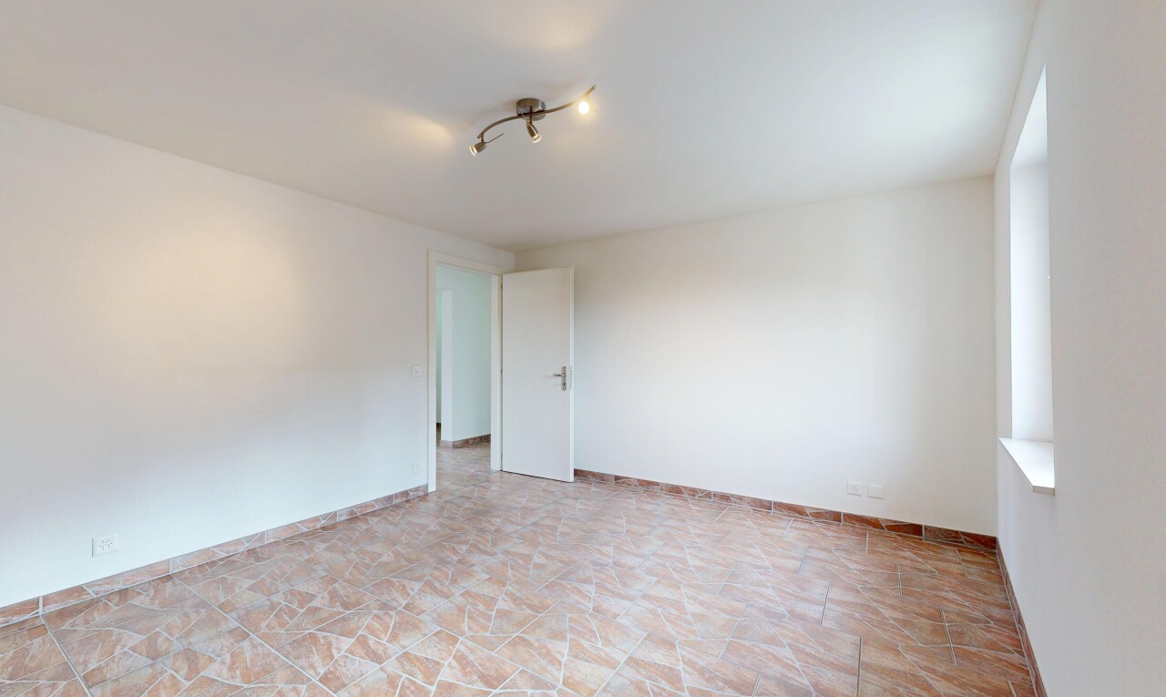unfurnished room featuring baseboards