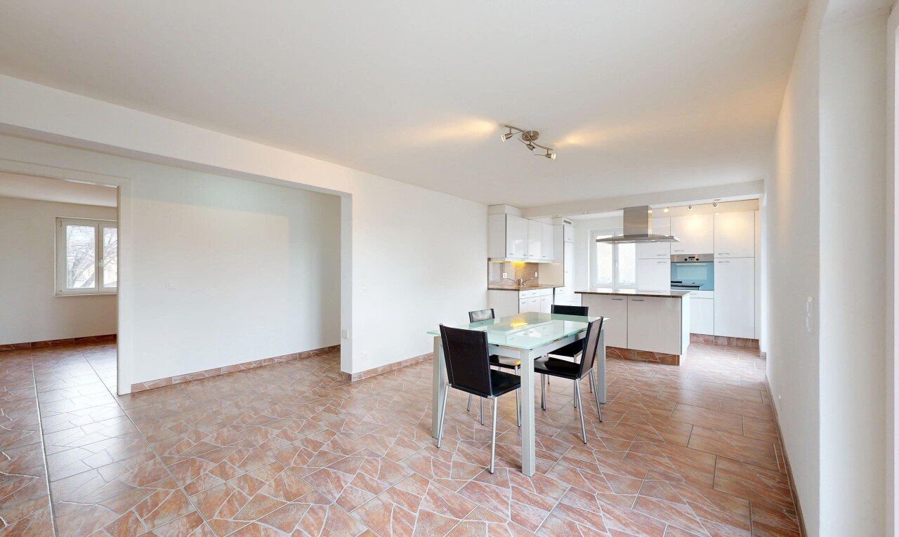 dining space with stone finish flooring