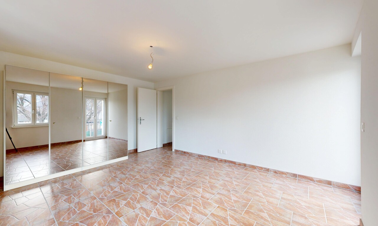 spare room with baseboards