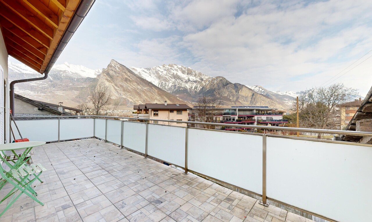 terrace featuring a patio and a mountain view