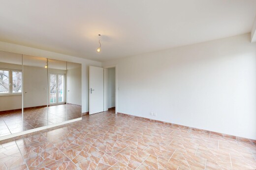 spare room with baseboards