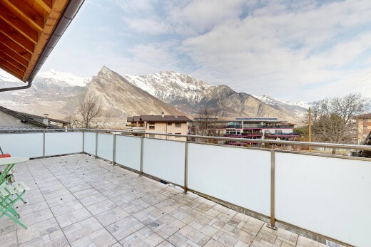 terrace featuring a patio and a mountain view