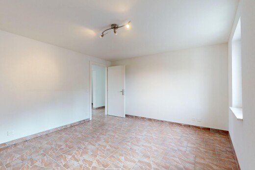 unfurnished room featuring baseboards