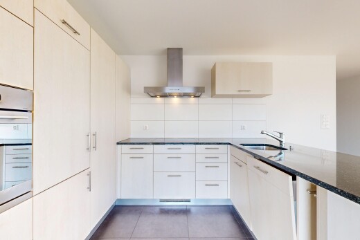kitchen featuring wall chimney range hood, dark stone countertops, wall oven, dark tile patterned floors, and decorative backsplash