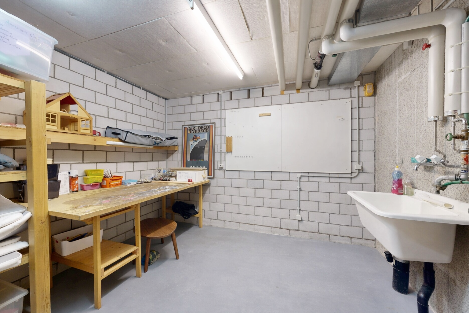 interior space with finished concrete floors and a workshop area