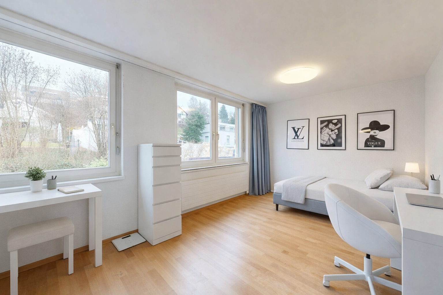 room with an office area and light wood-style floors