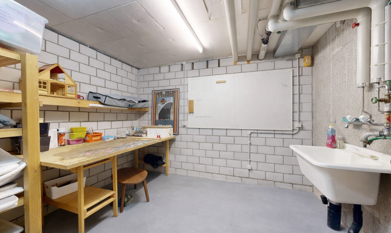 interior space with finished concrete floors and a workshop area