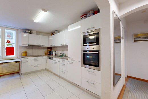 küche mit light floor, white cabinets, weiße schränke, gewölbte gehwege, und doppel backofen