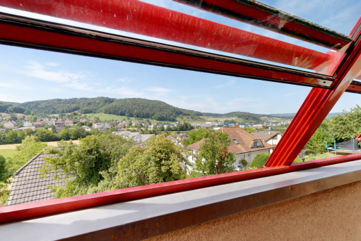 balcony featuring a residential view and a mountain view