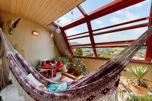 patio / terrace featuring a sunroom